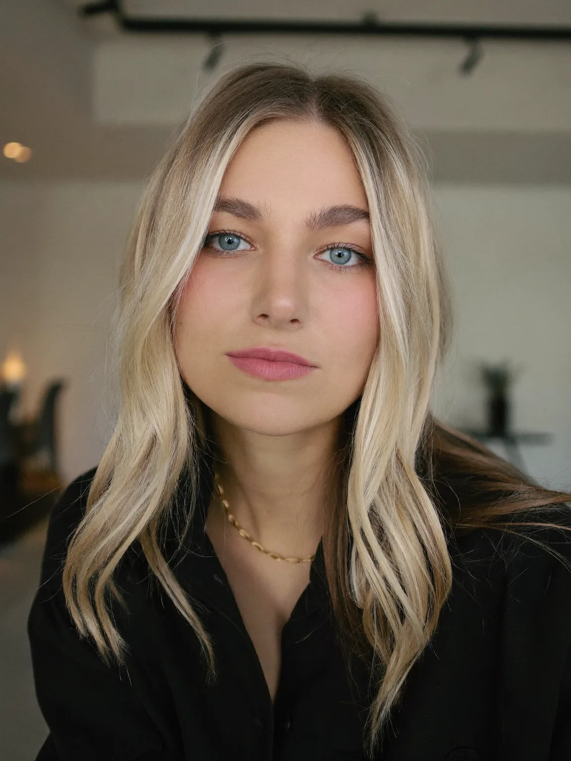 Sandy Blonde Wavy Layers with Medium Volume Curtain Bangs